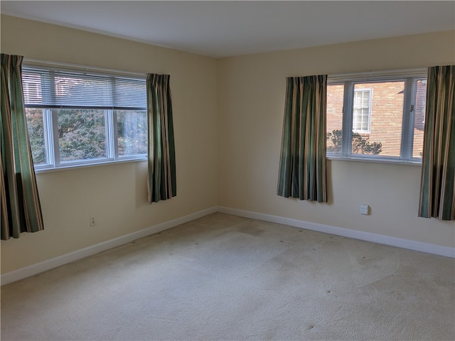 empty room featuring light colored carpet