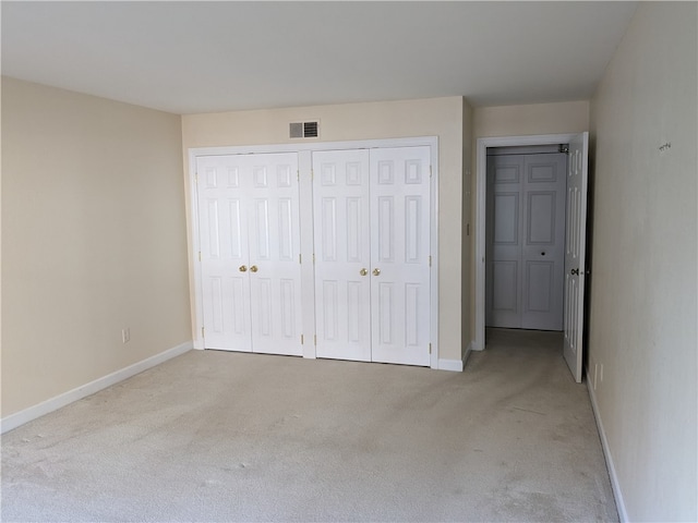 unfurnished bedroom with light carpet