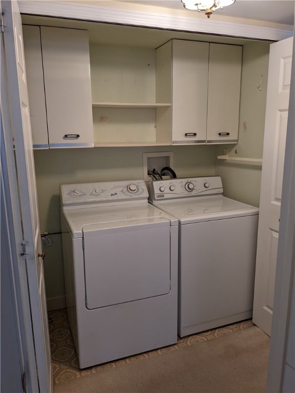 laundry room featuring washer hookup, cabinets, carpet floors, and washing machine and clothes dryer