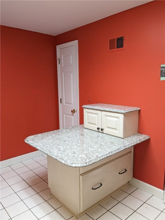 interior space featuring vanity and tile flooring