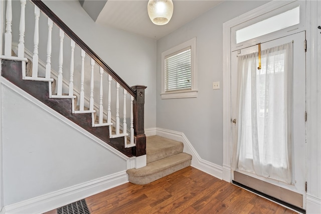 entrance foyer with dark hardwood / wood-style flooring