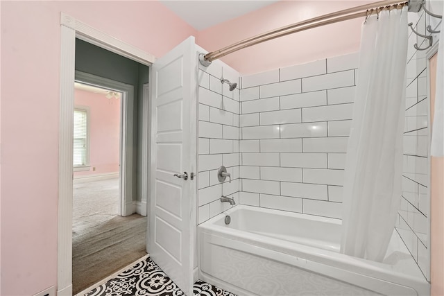 bathroom with hardwood / wood-style flooring and shower / bath combo with shower curtain