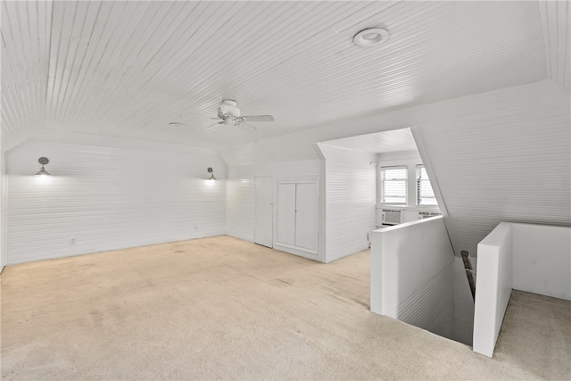 bonus room featuring ceiling fan and light carpet