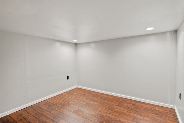 spare room featuring dark hardwood / wood-style flooring