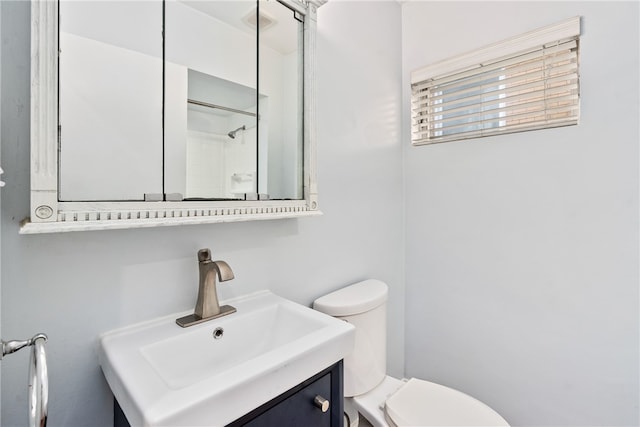 bathroom with oversized vanity and toilet