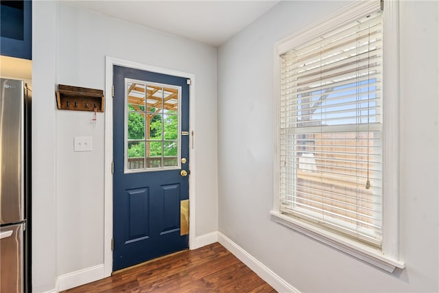 entryway with dark hardwood / wood-style flooring