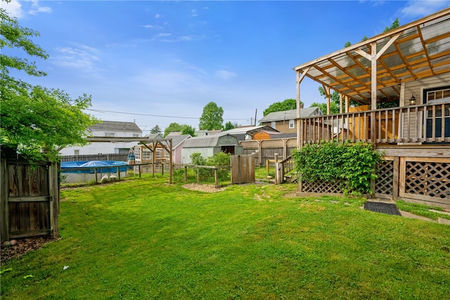 view of yard featuring a pergola and a wooden deck