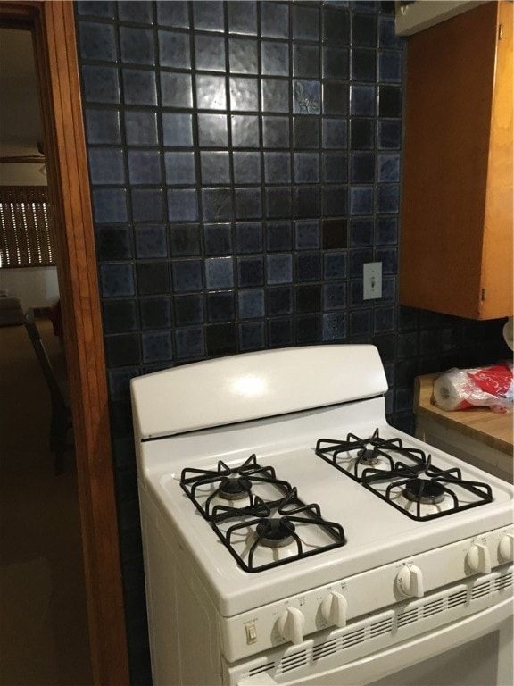 kitchen with white range with gas cooktop