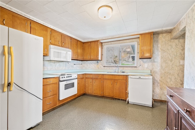 kitchen featuring sink and white appliances