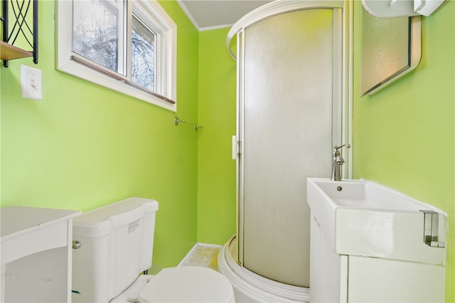 bathroom with ornamental molding, toilet, and vanity