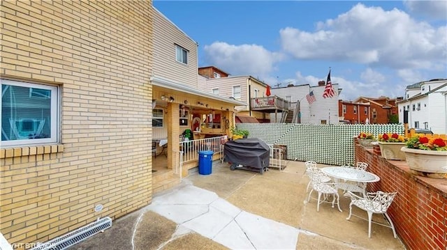 view of patio featuring a grill