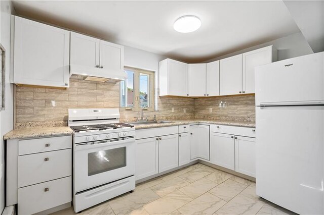 kitchen featuring backsplash, refrigerator, ventilation hood, light tile patterned floors, and stove