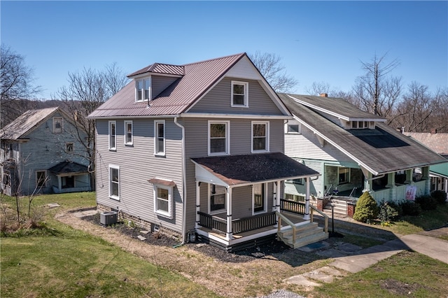 view of front of property with central AC unit, a front lawn, and a porch