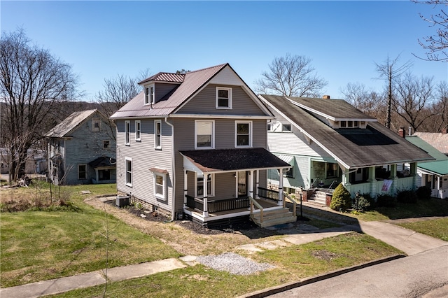 view of front of property featuring central AC, a porch, and a front yard