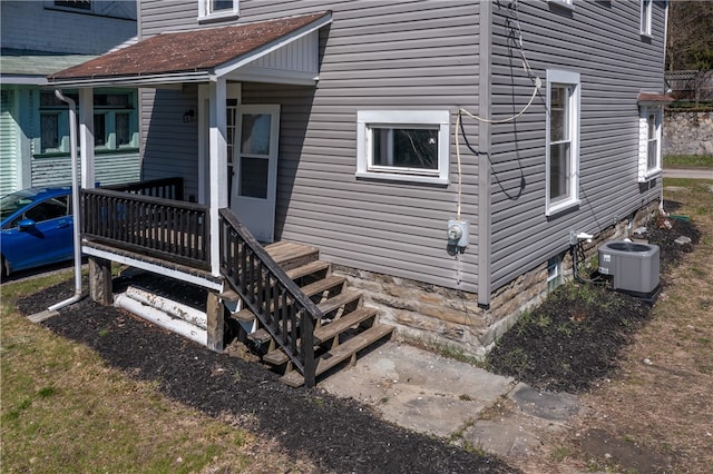 doorway to property with central air condition unit