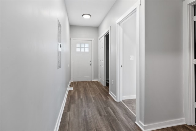 corridor featuring dark hardwood / wood-style floors