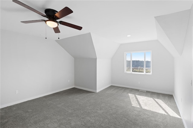 additional living space with carpet flooring, ceiling fan, and lofted ceiling