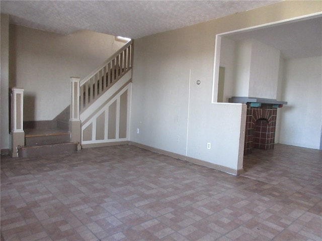 unfurnished living room with tile flooring