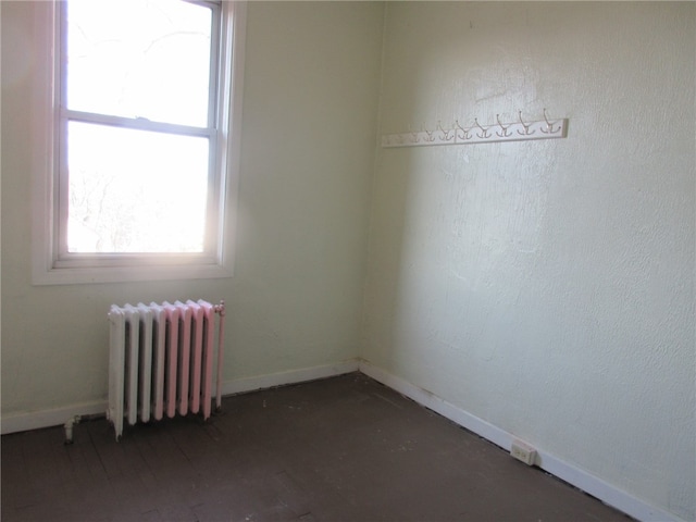 unfurnished room with radiator