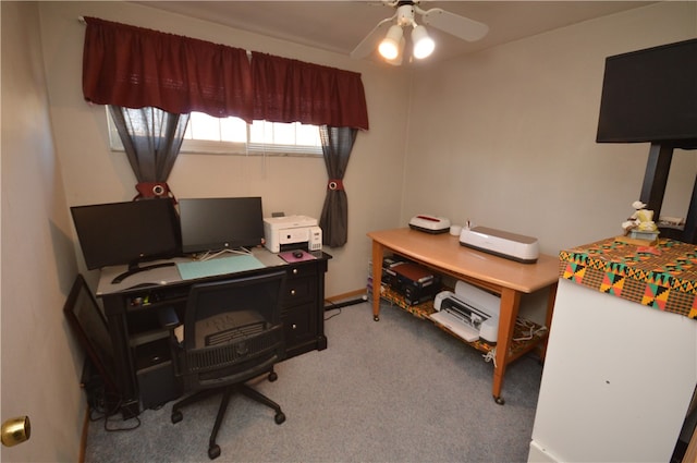 carpeted office featuring ceiling fan