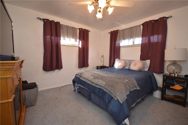 bedroom with ceiling fan and carpet floors