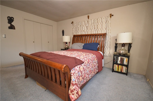 bedroom featuring a closet and carpet flooring