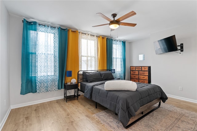 bedroom featuring light hardwood / wood-style flooring and ceiling fan