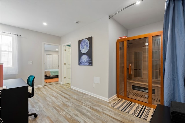 office area with light hardwood / wood-style floors