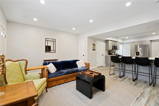 living room with light hardwood / wood-style floors