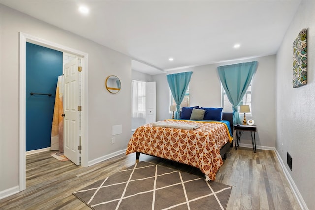 bedroom with light hardwood / wood-style floors