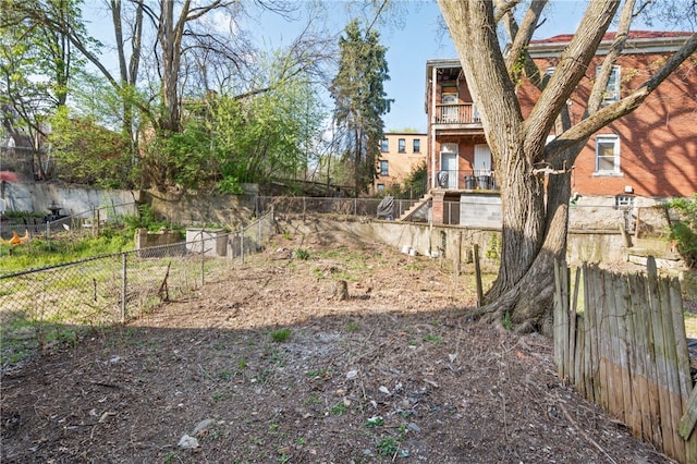 view of yard featuring a balcony