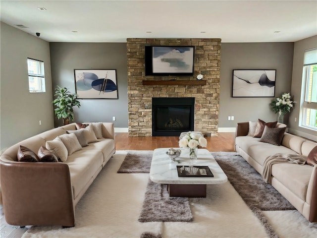 living room featuring a fireplace and hardwood / wood-style floors