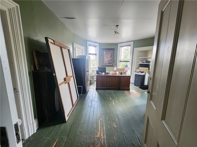 corridor featuring dark hardwood / wood-style floors and built in features