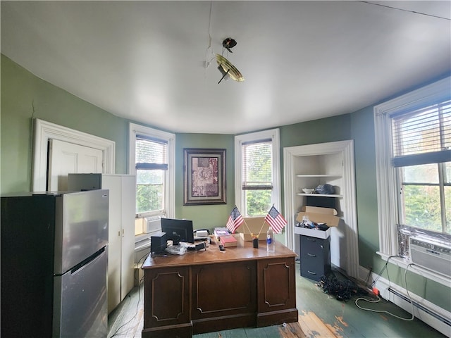 office with a baseboard heating unit and light wood-type flooring