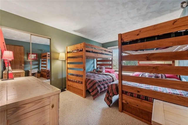 bedroom featuring light colored carpet