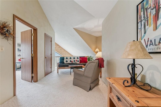 interior space with light colored carpet and vaulted ceiling