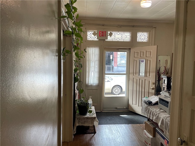 entryway with dark carpet