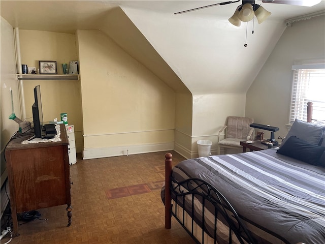 bedroom with ceiling fan and vaulted ceiling