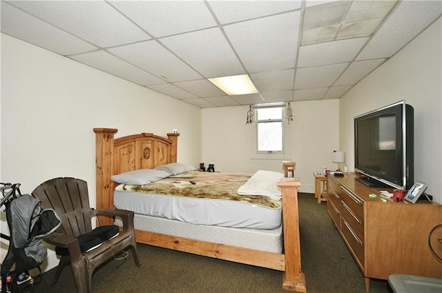 carpeted bedroom with a drop ceiling