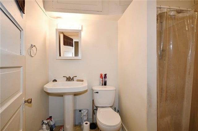 bathroom with sink and toilet