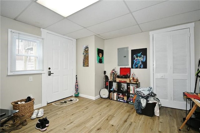 entrance foyer with a drop ceiling and light hardwood / wood-style flooring