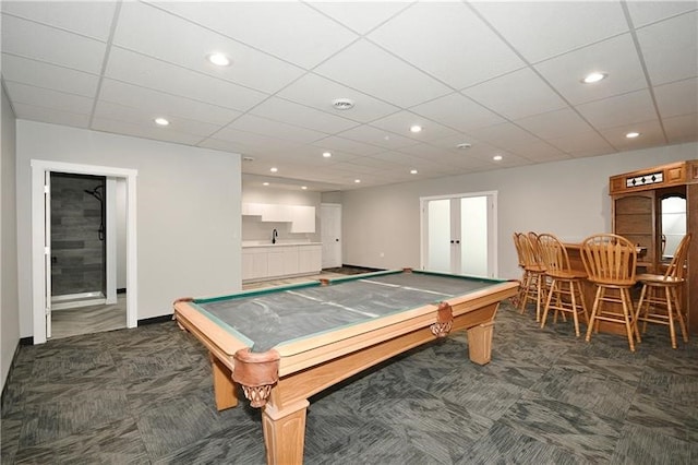 recreation room with billiards, dark colored carpet, and a paneled ceiling