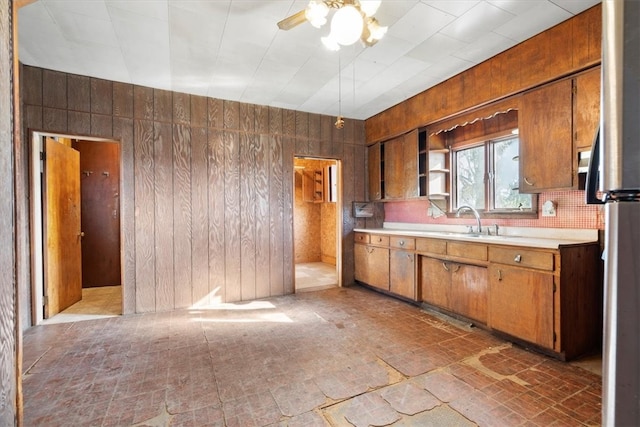 kitchen with ceiling fan and light tile flooring