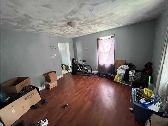 miscellaneous room with dark hardwood / wood-style floors