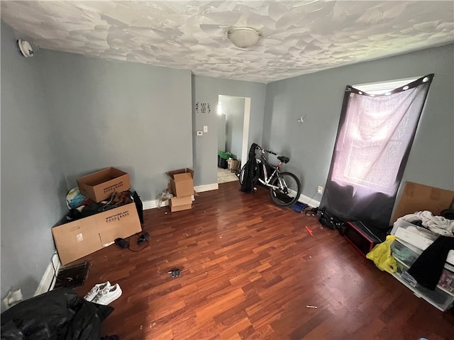 misc room with dark wood-type flooring