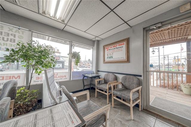 sunroom with a paneled ceiling