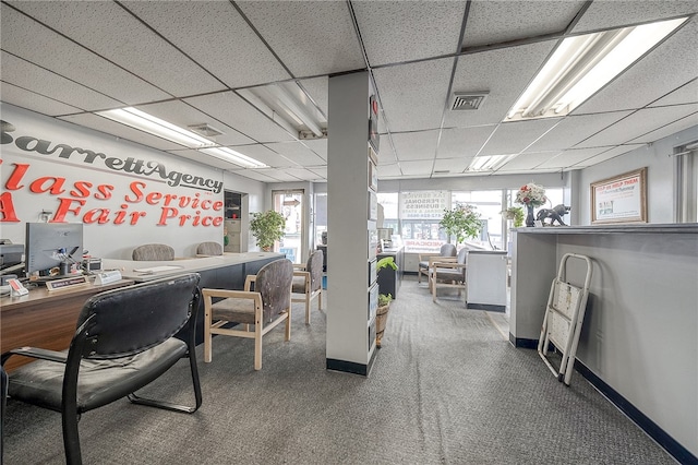 office space with carpet flooring and a paneled ceiling