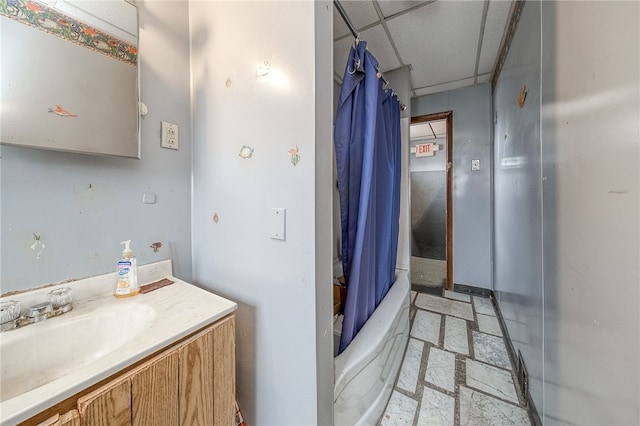 bathroom with shower / bathtub combination with curtain, tile floors, vanity, and a paneled ceiling