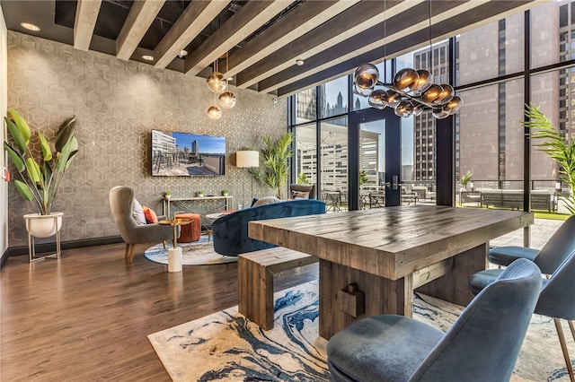 dining space with an inviting chandelier and dark wood-type flooring