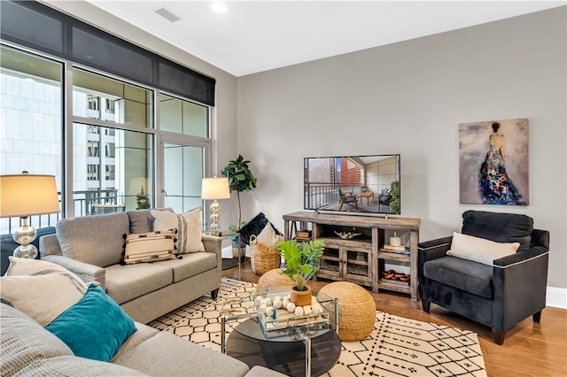 living room with light hardwood / wood-style flooring